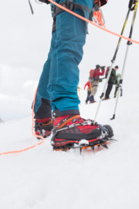 Climber on the way to the Bishorn summit, roped on during a blizzard and heavy fog over the glacier Climber on the way to the Bishorn summit, roped on during a blizzard and heavy fog over the glacier